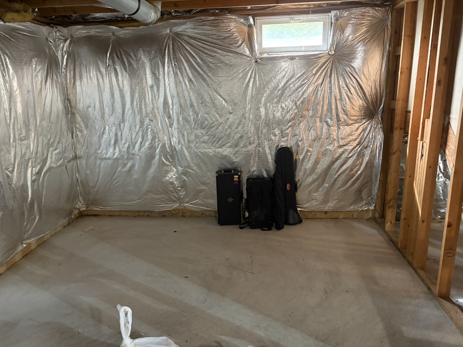 Basement room cleared down to bare concrete after cleanout