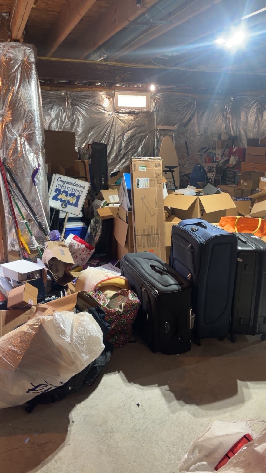 Basement storage room full of boxes before cleanout